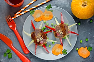 Meatball spiders. Creative food idea meatballs with colorful bell pepper shaped funny spider or octopus for kids, Halloween lunch