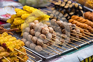 Meatballs with bamboo, wood stick. Traditional Street Food Thailand