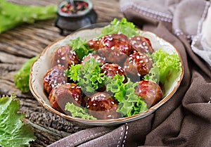 Meatballs with beef in sweet and sour sauce.