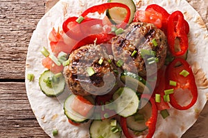 Meatballs with fresh vegetables and Flatbread close-up. Horizontal top view