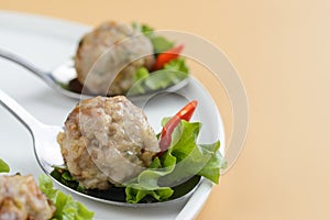 Meatballs with sauce and herbs