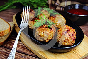 Meatballs in skillet with sauce