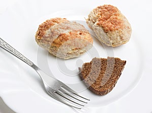 Meatloaf with fork and bread on plate