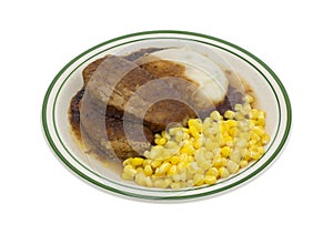 Meatloaf with gravy potatoes and corn TV dinner on plate
