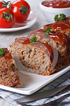 Meatloaf with ketchup closeup, vertical