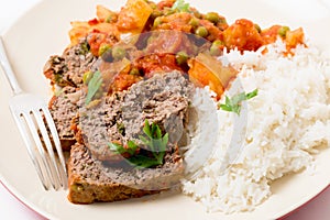 Meatloaf meal with rice and fork