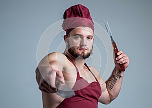 meatman use kitchen utensils. handsome bodybuilder cook bbq meal. food additives for sportsman. daily calorie diet. sexy