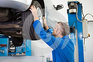 Mechanic adjusting the tire wheel