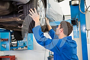 Mechanic adjusting the tire wheel