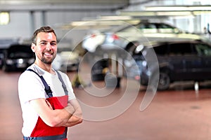 Mechanic in a car repair shop - diagnosis and troubleshooting photo