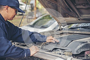 Mechanic car service auto garage in automotive mobile center. Technician workshop repair engine motor vehicles service mechanical