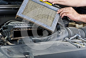 Mechanic changing car filter