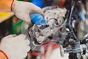 Mechanic Check and Add Brake Fluid on Motorcycle brake reservoir