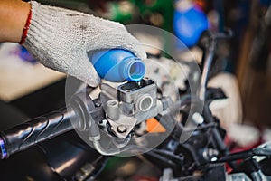 Mechanic Check and Add Brake Fluid on Motorcycle brake reservoir