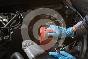 Mechanic checking battery, Close-up