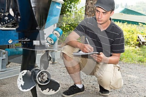 A mechanic checking the boat propeller