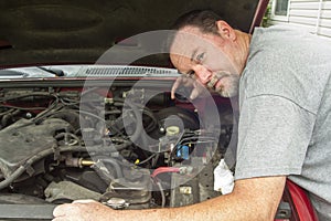 Mechanic Checking The Brake Fluid In A Master Cylinder