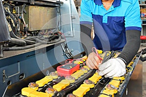 Mechanic is checking the quality Battery Capacity Tester Voltmeter