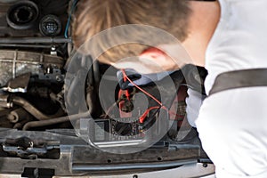 Mechanic checks electronics accumulator photo