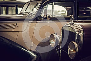 Mechanic in classic car restoration workshop