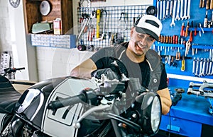 Mechanic cleaning a motorcycle