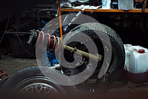 a mechanic disassembles an old dirty car engine