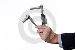 Mechanic engineer holding digital torque wrench and ratchet