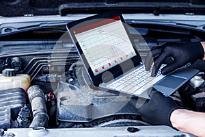 Mechanic engineer repair car at car service station