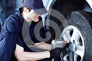 Mechanic engineer repair car at car service station