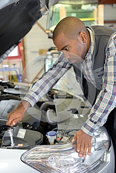 Mechanic fixing a car