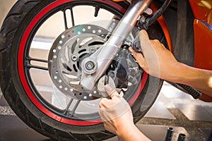 Mechanic fixing motocycle worn motorcycle drum breaks shoes