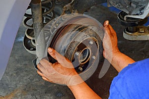 The mechanic is fixing the problem car.