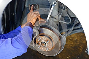 The mechanic is fixing the problem car.