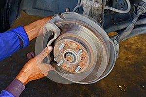 The mechanic is fixing the problem car.