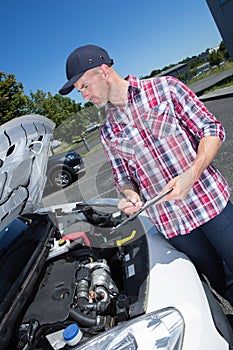 mechanic fixing van outdoors