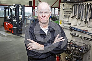 Mechanic in forklift garage