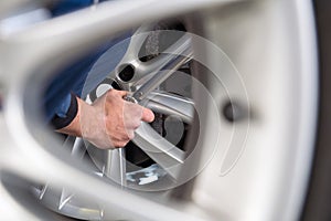 Mechanic hands at a tire service center