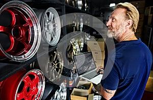 A mechanic his tire stocks