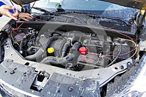 Mechanic inspecting a car engine