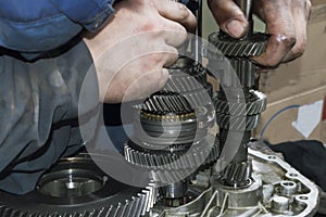 The mechanic installs the primary and secondary shaft in the housing of the manual transmission