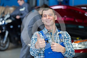 mechanic man holding wrench