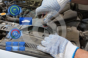 Mechanic man with wrench repairing car at workshop