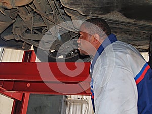 Mechanic Performing a Routine Service Inspection