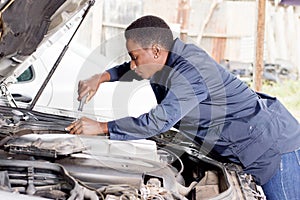 Mechanic repaire a car . photo