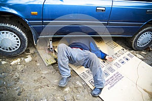 Mechanic repairing car