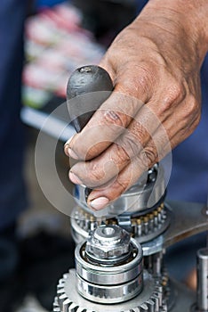 Mechanic repairing a gearbox