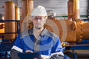 The mechanic - the repairman , operator production gas, Oil, gas industry. gas conditioning equipment and valve armature