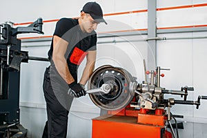 Mechanic repairs a crumpled disc, tire service
