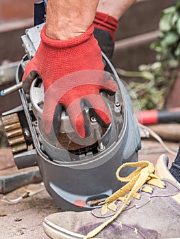 The mechanic repairs