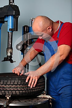 Mechanic repairs tire